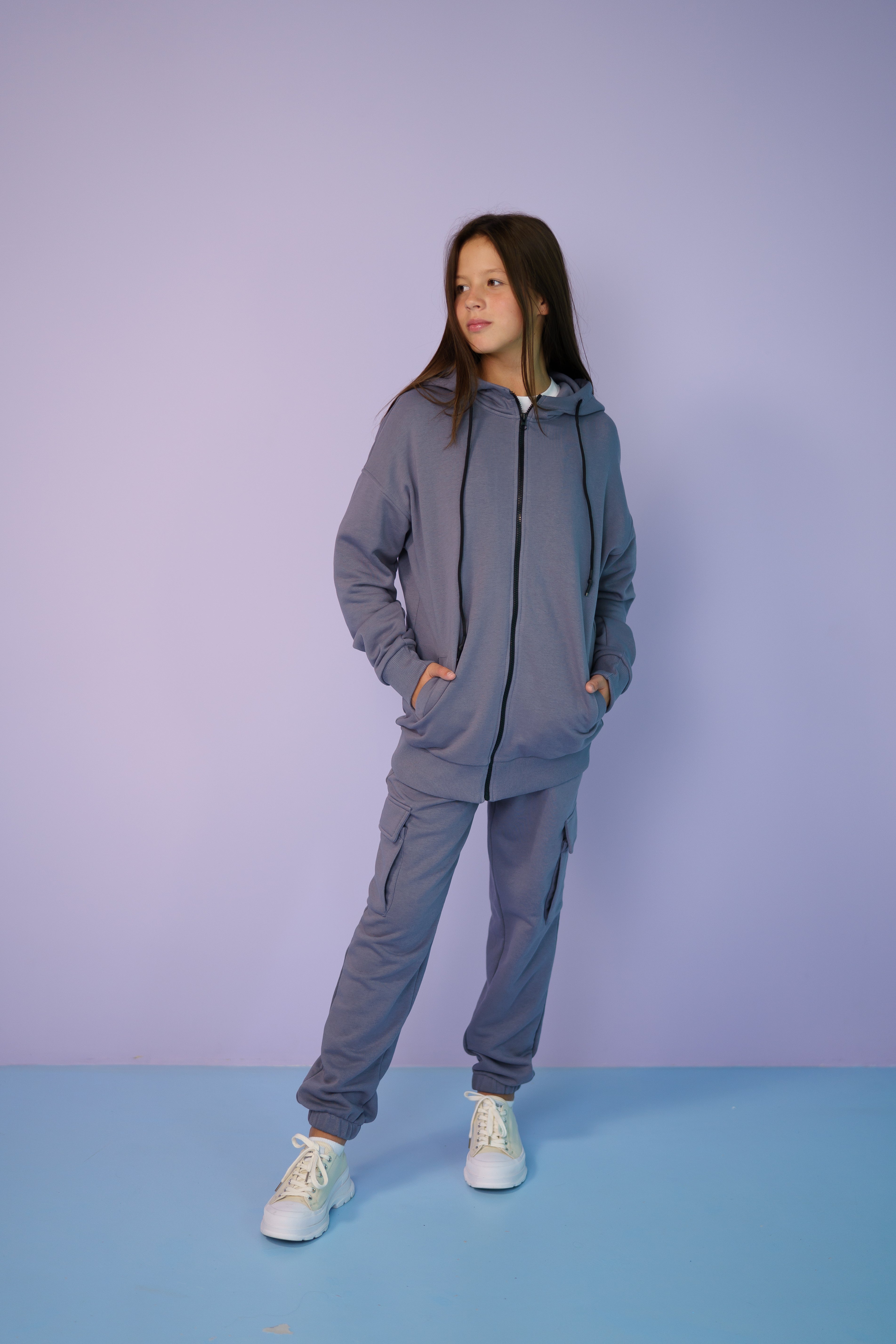 girl wearing a gray tracksuit by Lemoni